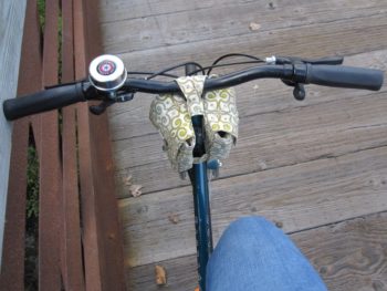 mini saddlebags on bicycle handlebars, top view