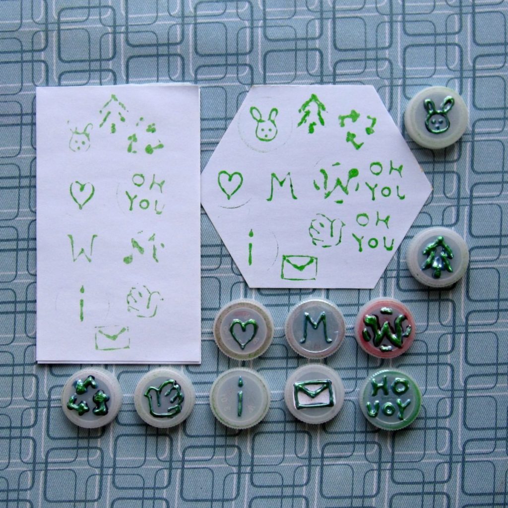 Stamps made from bottlecaps and three rounds of 3D paint; impressions after 2 and 3 rounds of paint shown.