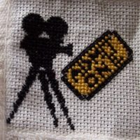 Movie Ticket and Camera