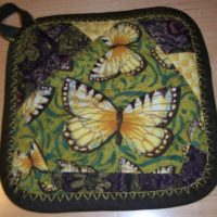 butterfly-adorned quilted potholder