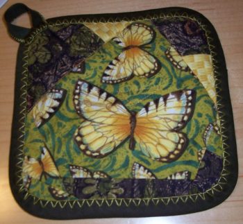 butterfly-adorned quilted potholder