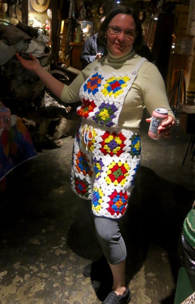 Me wearing granny square shortalls at the Main Street Museum