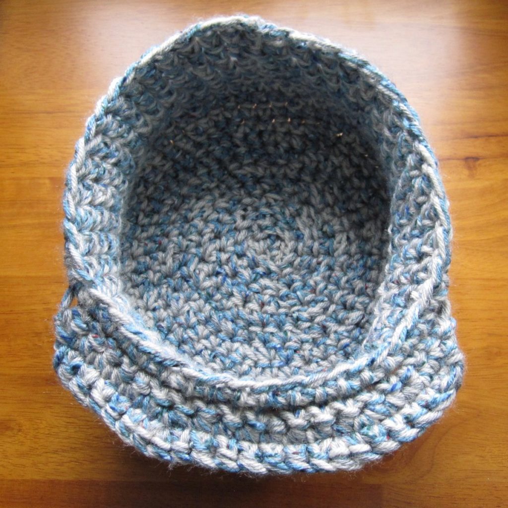 bottom view of crochet snow hat, showing brim
