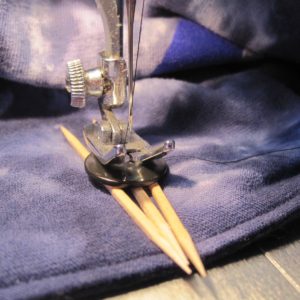 machine-sewing a button