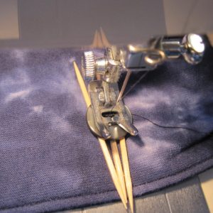 machine-sewing a button