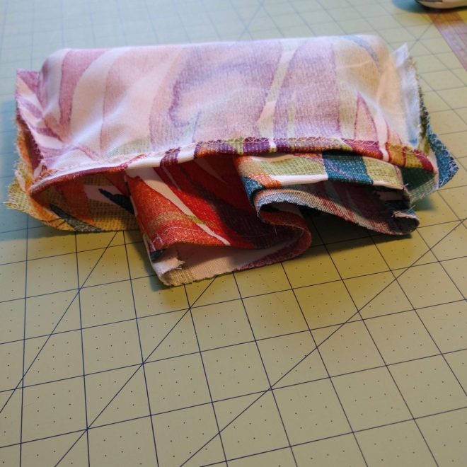 "Pleating" method of inserting one pouch in the other