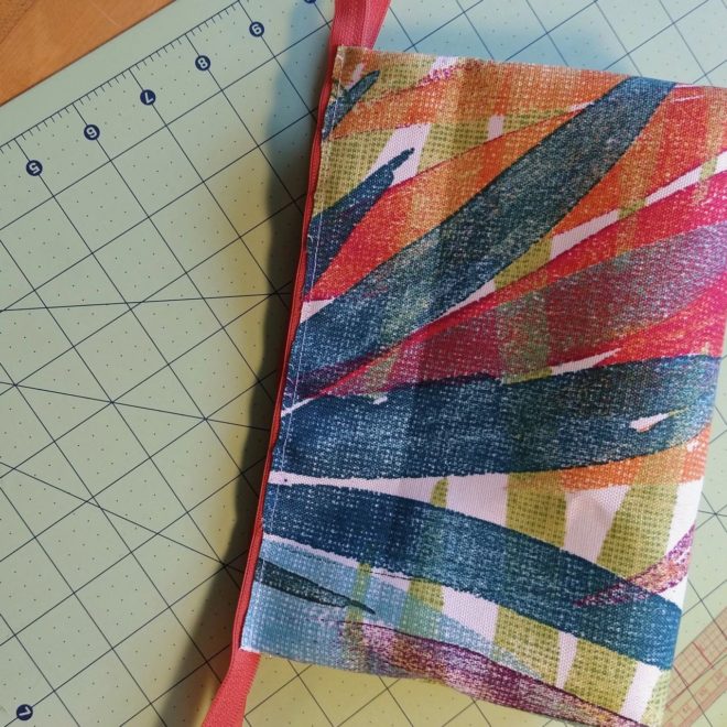 Fabric trimmed to below edge of zipper tape