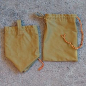 drawstring belt pouches laid out on floor