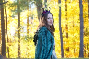 Me in wood elf costume with a background of yellow autumn leaves